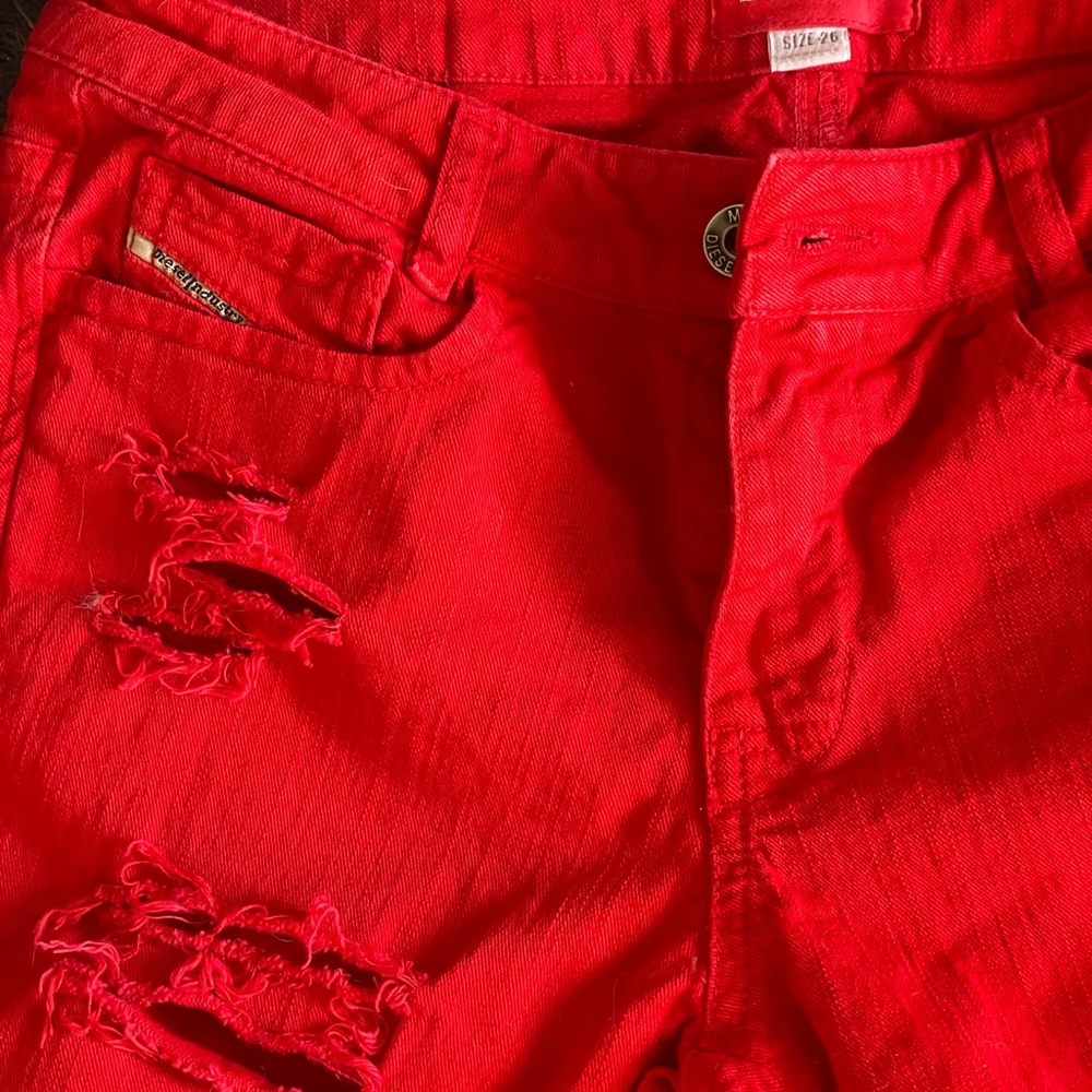 Trendy Diesel red ripped jeans